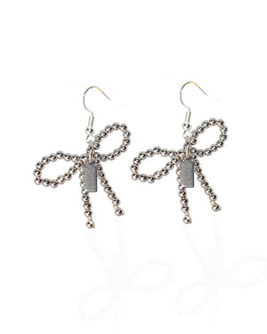 Earrings with white gold bows - image