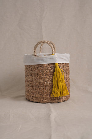 Basket with tassel and cloth - image