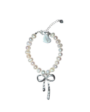 Pearl bracelet with silver bow charm - image