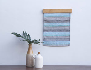 Handwoven textile wall hanging - image